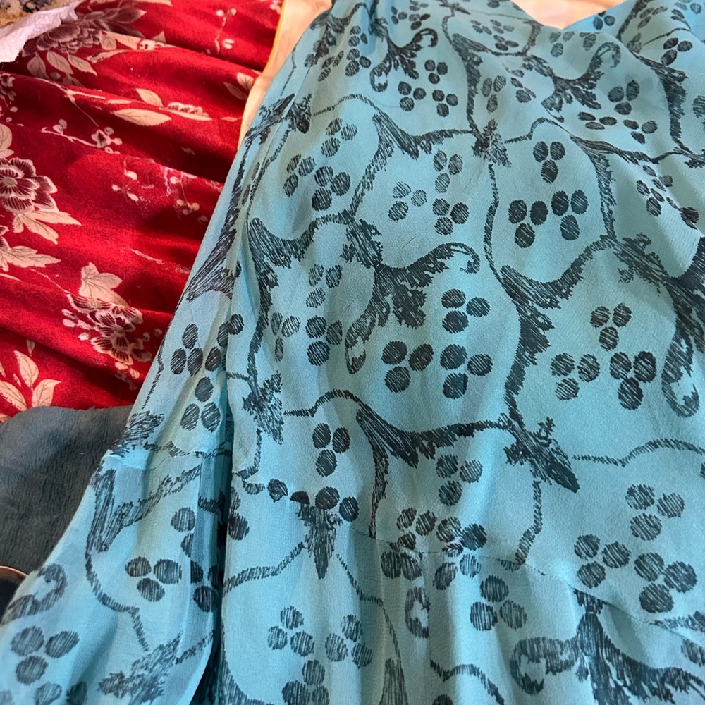 Beautiful DVF asymmetrical hemline, sleeveless w\ scarf to be worn around neck.